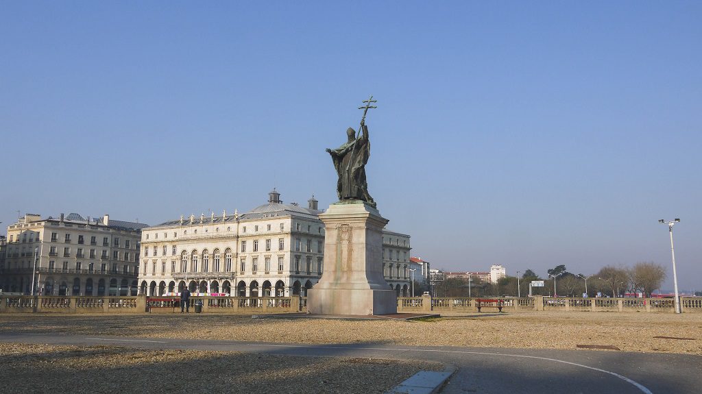 Behind the statue is Place de la Liberte