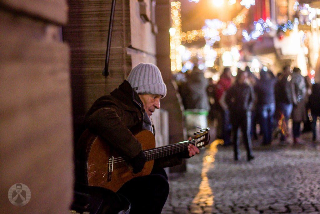 City busker serenading the visitors