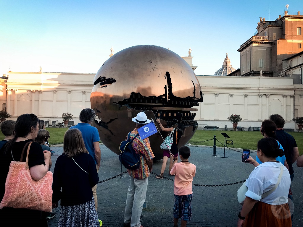 Our tour guide trying to rotate this metal globe