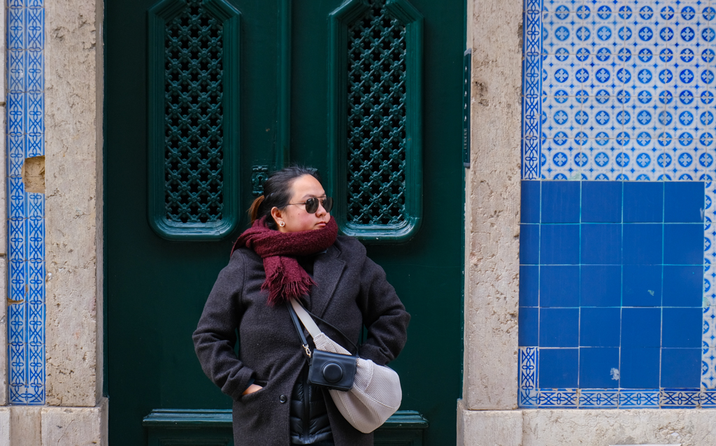 Iris in front of the ubiquituous tiles in Lisbon